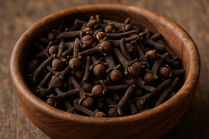 real looking cloves in a wooden bowl